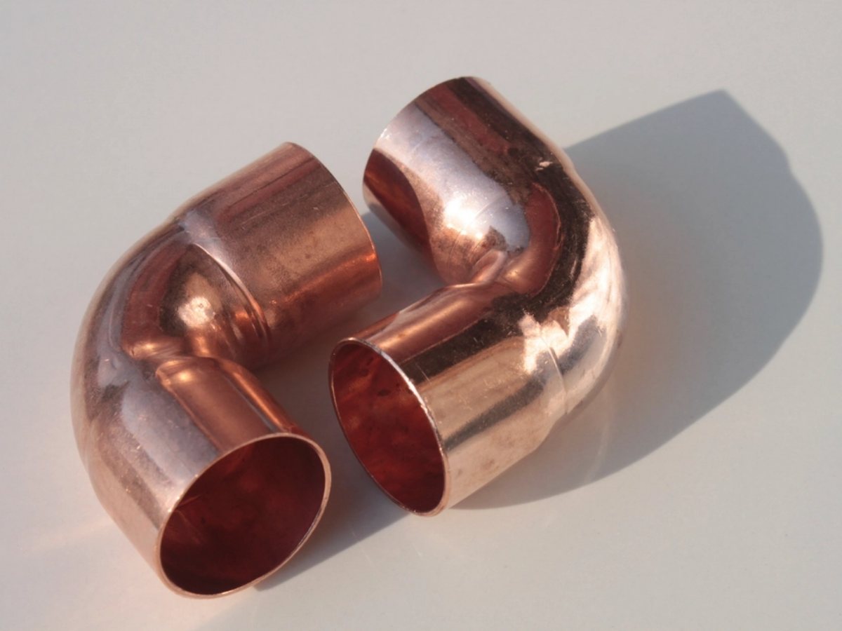 Copper elbow fittings (illustrative stock photograph)
