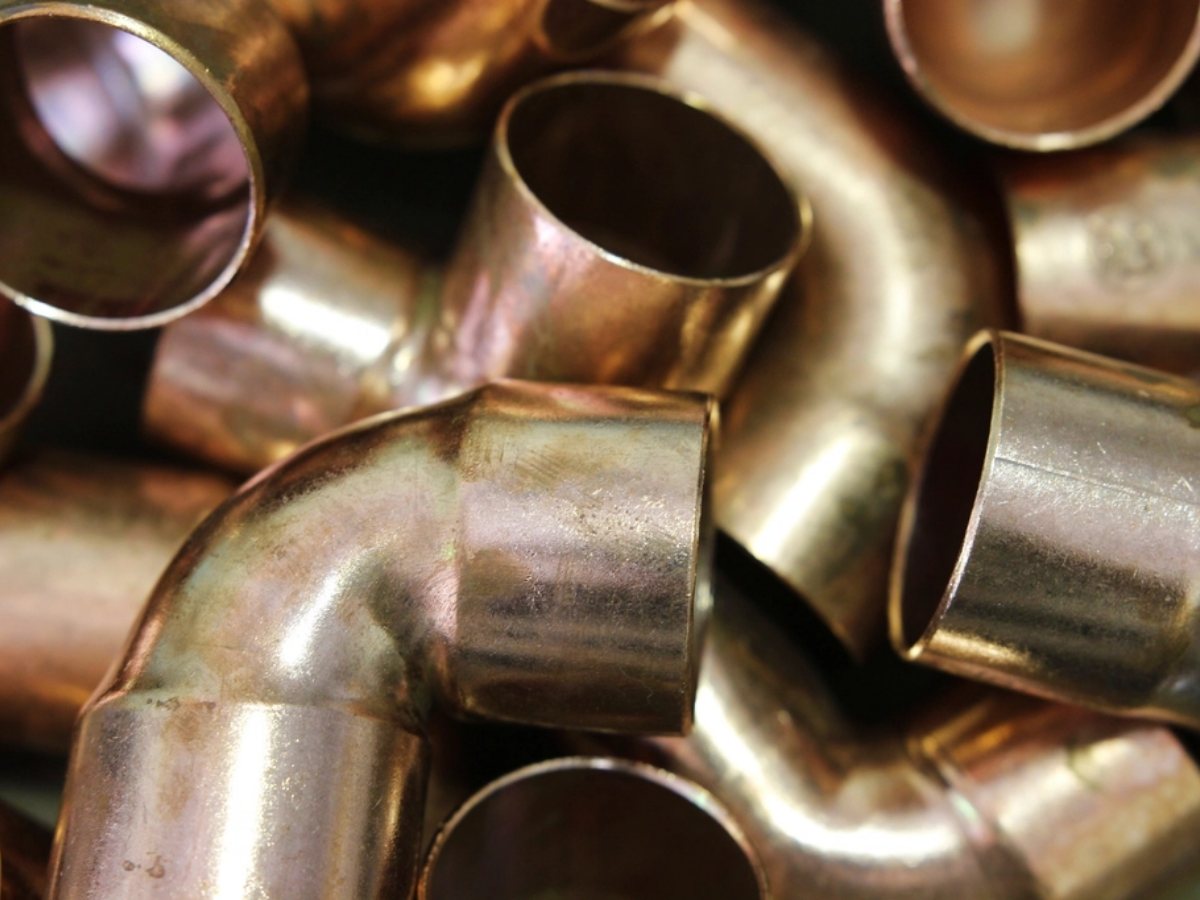 Cut lengths of copper pipe (illustrative stock photograph)
