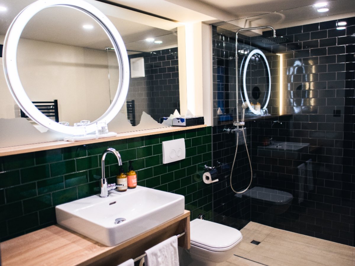 A tiled bathroom with a basin (illustrative stock photograph)